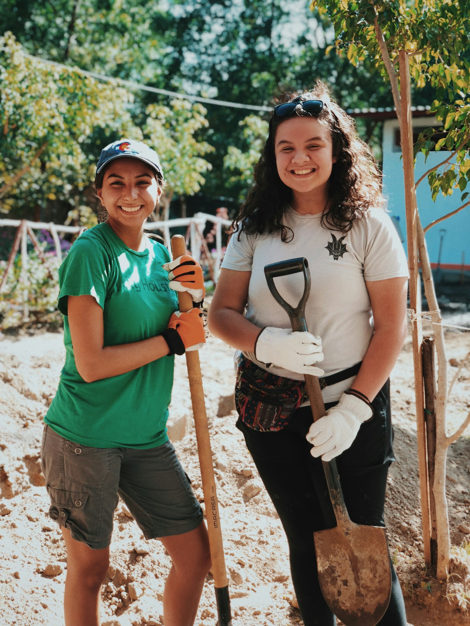 Two smiling nonprofit volunteers at a community project
